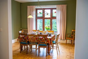 Dining room with table and 8 chairs. Wood floor