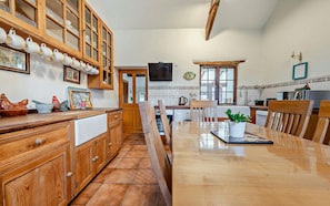 Kitchen with large dresser and table and chairs