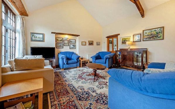 Sitting room with French doors leading to the courtyard