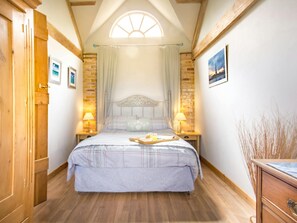 Master bedroom with bedside tables and lamps