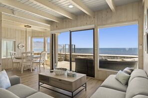 Main Living Area with ocean view, adjacent to dining area with bay window.