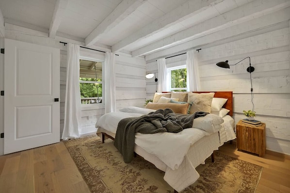 The primary suit in located downstairs with a luxurious king size bed and ensuite bathroom.