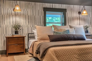 Upstairs guest room with a comfortable king bed.