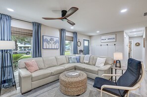 Large seating area with smart TV and soundbar.