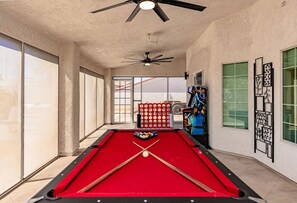 Enjoy a fully equipped entertainment space with a pool table and cozy vibes.
