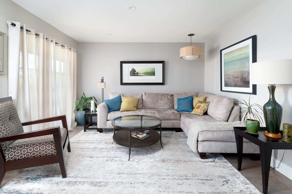 This adorable cottage exudes charm and grace throughout, starting in the living area. We'll take a quick tour of the home, then do a second pass to show more pictures. Here we go!