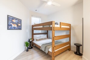 Bedroom 2 features a queen/full bunk bed.
