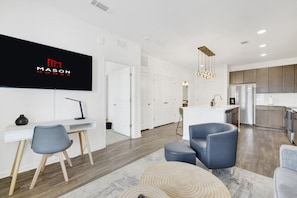 Enjoy open-concept living spaces adorned with large windows that invite natural light, creating a warm and vibrant atmosphere.