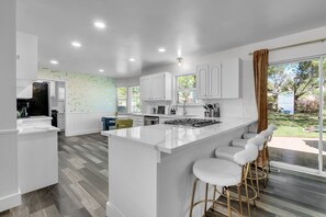 Enjoy casual dining and lively conversations at the spacious kitchen counter.