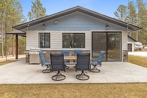 Indulge in outdoor dining and grilling with our inviting setup, offering a perfect blend of relaxation and culinary adventures while enjoying the view of the Black Hills