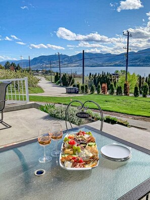 Enjoy a glass of wine with views over Okanagan Lake.