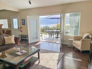 Living room with access to two spacious patios