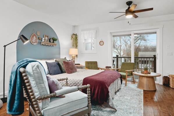 Bedroom with a cozy queen bed and a cozy chair