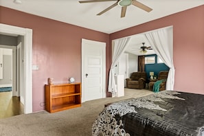 Master bedroom with King bed and extension with mini theatre.