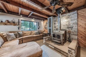 Enjoy the oozy living room with a wood burning fireplace! 