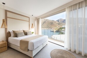 Glass door bedroom with comfortable bed.