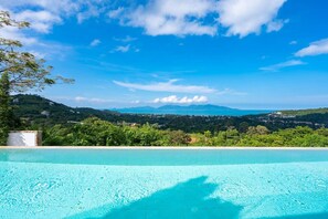 "Wake up to enchanting views of our neighbor, Koh Phangan, right from your bedroom."