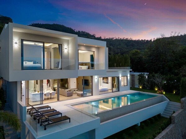 "Stunning evening sunset painting the sky purple - perfect view from our villa by the drone."
