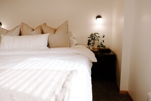 Plush beddings and beautiful nightstands for the bedroom