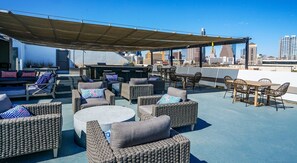 Check out the Skyline views on this large rooftop patio with plenty of seating
