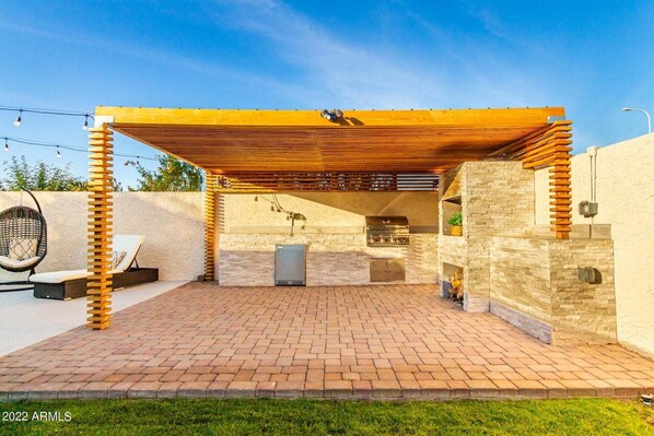 Pergola w/ Lighting, Grill, Mini fridge.