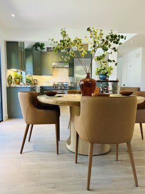 Dining area furnished by RH Modern