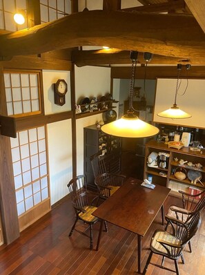 The living and dining areas feature thick beams.