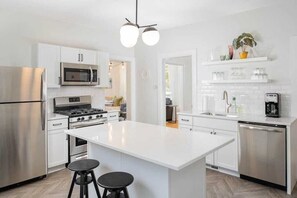 All new fully equipped kitchen with quartz countertops new appliances
