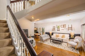 The Living Room has plenty of space to chat, read, and watch your favorite show on the 55" smart TV.