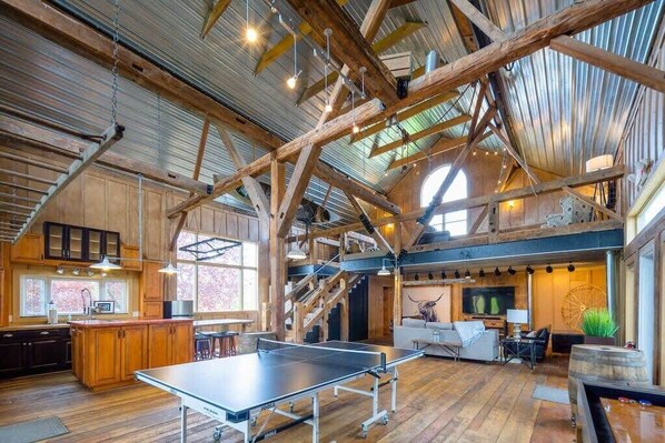 The Recreation Barn, complete with 2 TV's, ping pong and shuffleboard table, kitchenette, loads of board games and plenty of seating.