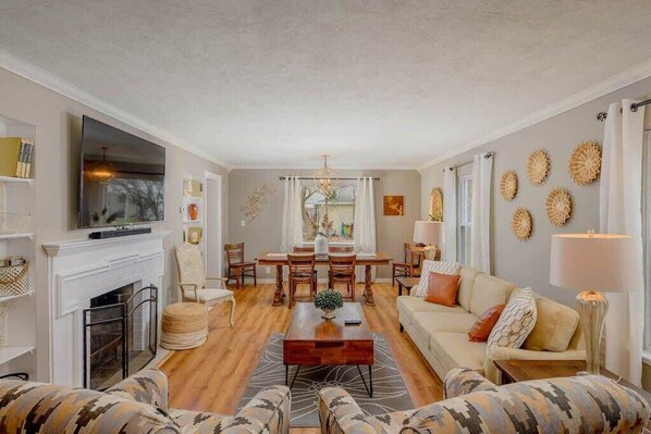 Warm and inviting living room with 65" smart TV.
