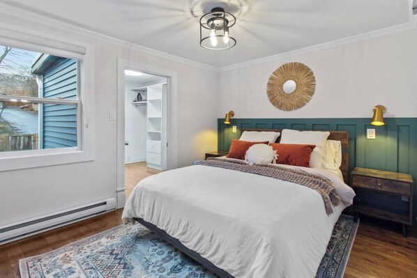 Bedroom 1: Cozy bedroom, complete with soft, fresh linens and plush towels to ensure your comfort throughout your stay.