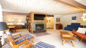 Main Level Seating Area with Wood Fireplace in Lincoln Condo