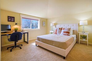 Another inviting master suite awaits on the 3rd floor, boasting a queen-size bed, ensuite bathroom, convenient working station, and breathtaking views
