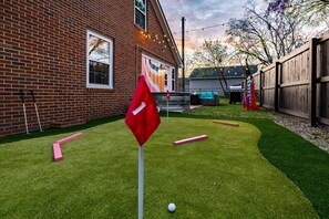 All-in-one outdoor entertainment area, perfect for families and friends. Here, you can enjoy Mini Golf, relax in our Heated Stock Tank Pool, gather around the Fire Pit Patio, and engage in life-sized Connect 4—all designed to create unforgettable moments in a single, harmonious space.