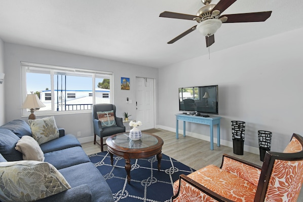 Spacious living room with lots of natural light and comfortable seating