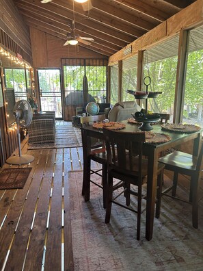 Enjoy a meal or morning coffee on the screened in porch