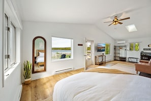 The upstairs primary king suite offers the ultimate escape with its own private balcony, seating area, coffee bar and en-suite full bathroom.
