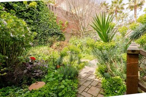 Unwind in your own private oasis nestled within our property—a tranquil garden retreat awaits.