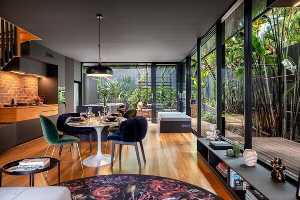 Our open plan living dining looks out to the courtyard garden.