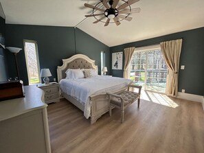 The primary bedroom was inspired by the elegance of Judy Garland’s era.  A brand new mattress ensures a restful night’s sleep.  Room darkening curtains allows  you to control the natural light streaming into the room from the slider to the deck.