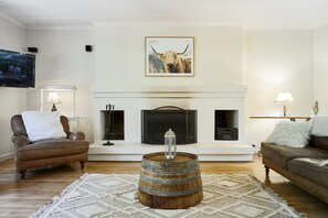 A grand open fireplace to spend cosy nights