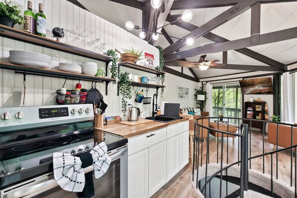 Fully equipped kitchen in open concept layout.