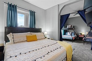Spacious bedroom with a King size bed, separated from the bunk room with curtains for additional privacy.