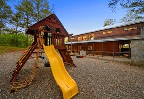 Check out this amazing playground for the kids, right in the backyard! It's the perfect place for them to burn off some energy while you relax nearby.
