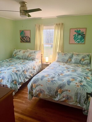 Bedroom w/ two full beds. Sleeps 4. Dresser and spacious closet. Flat screen TV