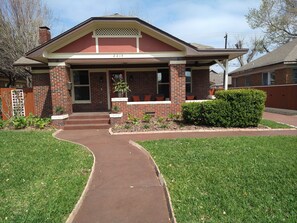 Brick Bungalow House adjacent with Beautiful Landscaping to Welcome Guests