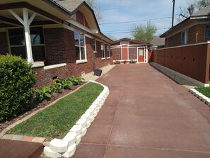 Ample Driveway Parking for Multiple Vehicles Stained and Lined with Pavers