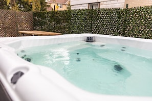 Enjoy a Soothing Soak in the Private Hot Tub