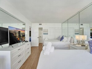 Master bedroom with 2 queen beds and TV